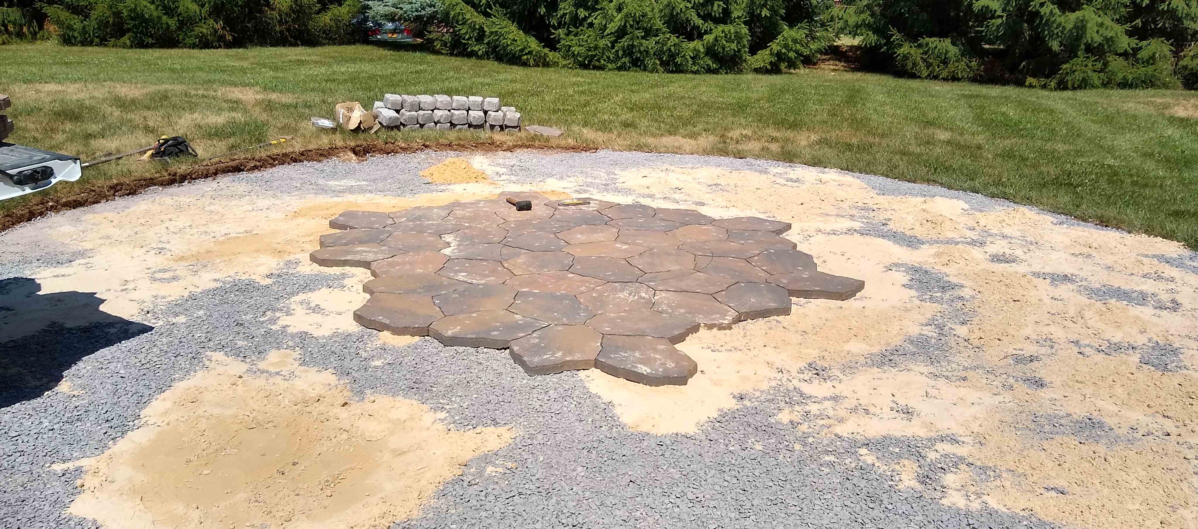 Fire pit pic: Gravel base laid, started laying pavers